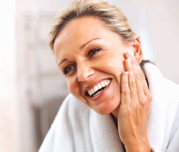 Woman smiling after her photofacial at Kingsway Dermatology in Etobicoke