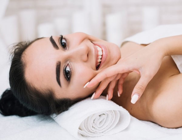 Black haired woman after fire and ice facial treatment