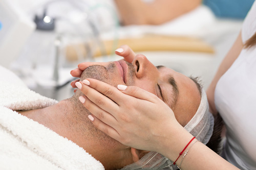 Man having facial treatment at Kingsway Dermatology